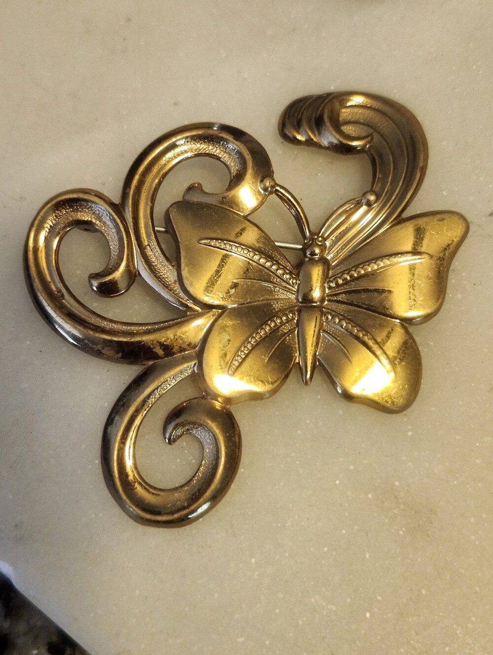 Stylish Gold Tone Butterfly Brooch With Ornate Swirling Detailing